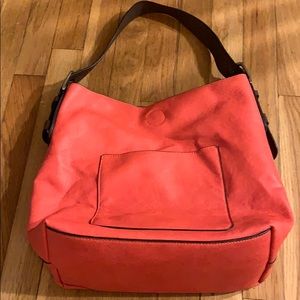 Shoulder purse with a detachable crossbody purse